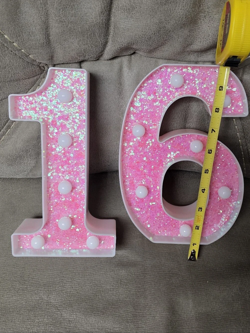 This is a pink glitter LED marquee number light, approximately 8.5 to 9 inches t